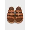 Brown sandals with gold hardware