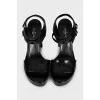 Leather sandals with a gold heel element