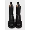 Leather boots with rough soles