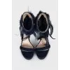 Suede heeled sandals with feathers
