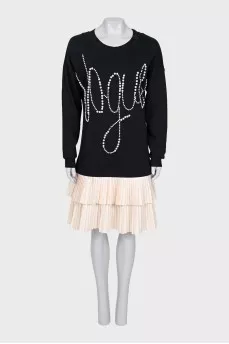 Dress decorated with beads and pleated hem