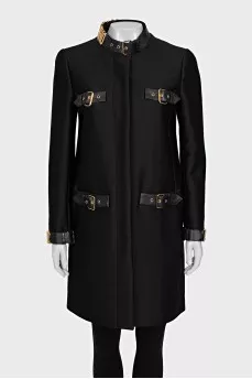 The black coat is decorated with a golden logo.