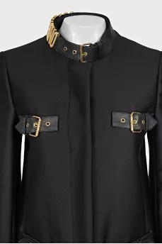 The black coat is decorated with a golden logo.