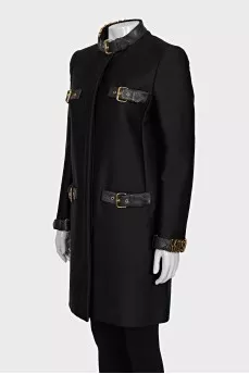 The black coat is decorated with a golden logo.