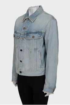 Distressed denim jacket with tag