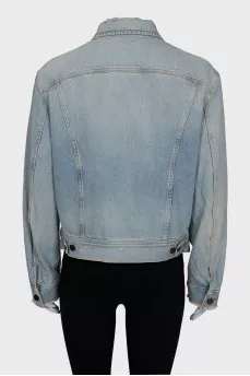 Distressed denim jacket with tag