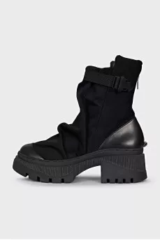 Textile and leather boots decorated with straps