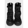 Textile and leather boots decorated with straps