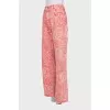 Pink jeans with a signature print