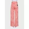 Pink jeans with a signature print