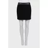 Black skirt with a chain belt