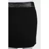 Black skirt with a chain belt