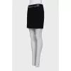 Black skirt with a chain belt