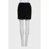 Black skirt with a chain belt