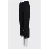 Trousers decorated with beads and crystals