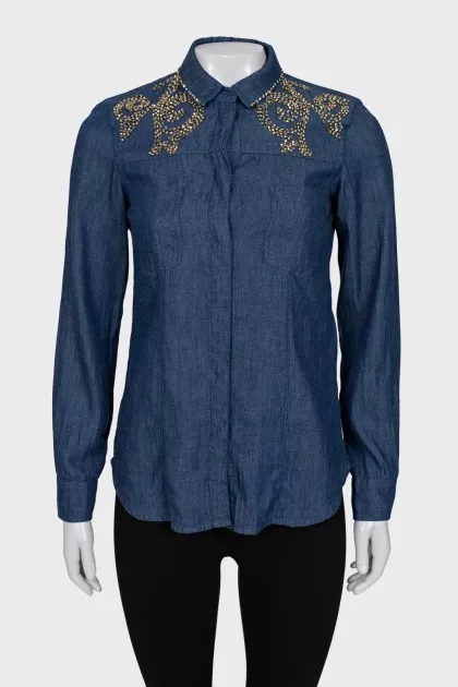 Shirt decorated with beads