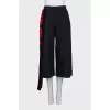 A suit of a hoodie and cropped trousers