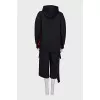 A suit of a hoodie and cropped trousers