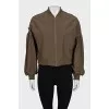 Bomber jacket decorated with bows