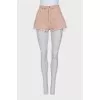 Pink denim shorts with buttons