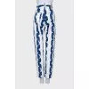 Striped jeans with signature monogram