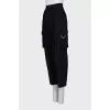 Cropped black trousers with tag