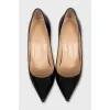 Black patent leather pumps