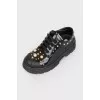 Black sneakers for children with golden beads with tag
