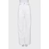 White jeans with cutouts at the waist