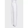White jeans with cutouts at the waist