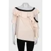 Blouse with asymmetrical sleeves