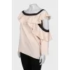 Blouse with asymmetrical sleeves