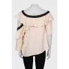 Blouse with asymmetrical sleeves