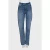 Blue jeans with asymmetrical cut