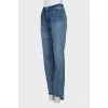 Blue jeans with asymmetrical cut