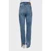 Blue jeans with asymmetrical cut