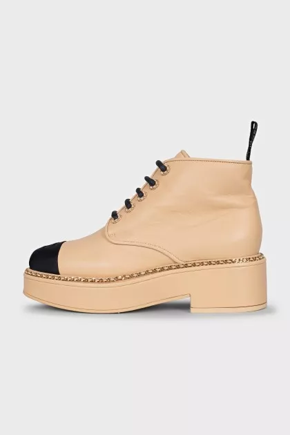 Beige boots with gold decor