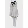 Skirt with frills decorated with brooches