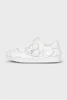 Leather sneakers decorated with a flower
