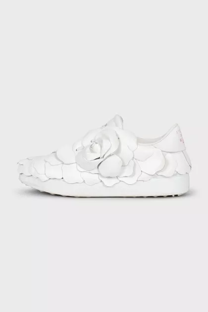 Leather sneakers decorated with a flower