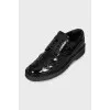 Patent leather shoes with perforations