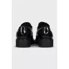Patent leather shoes with perforations