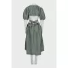 Green dress with a cutout at the waist