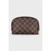 Cosmetic bag with a zipper in a signature print