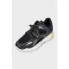 Leather and textile sneakers with a high sole