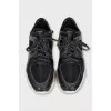 Leather and textile sneakers with a high sole
