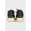 Leather and textile sneakers with a high sole