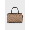 A bag with handles and a strap in a signature print