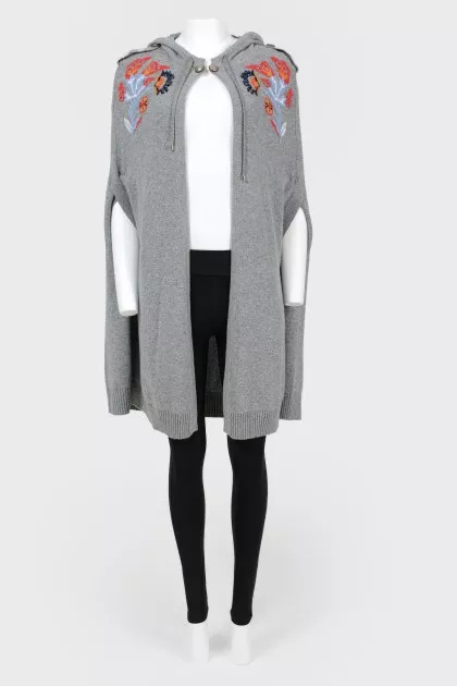 Knitted cape with drawstring hood