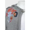Knitted cape with drawstring hood